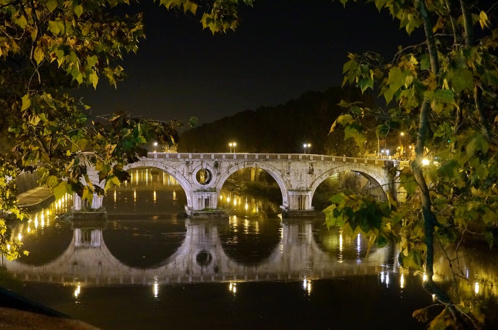 Ponte Sisto in Rome. Stone bridge photographed at night.