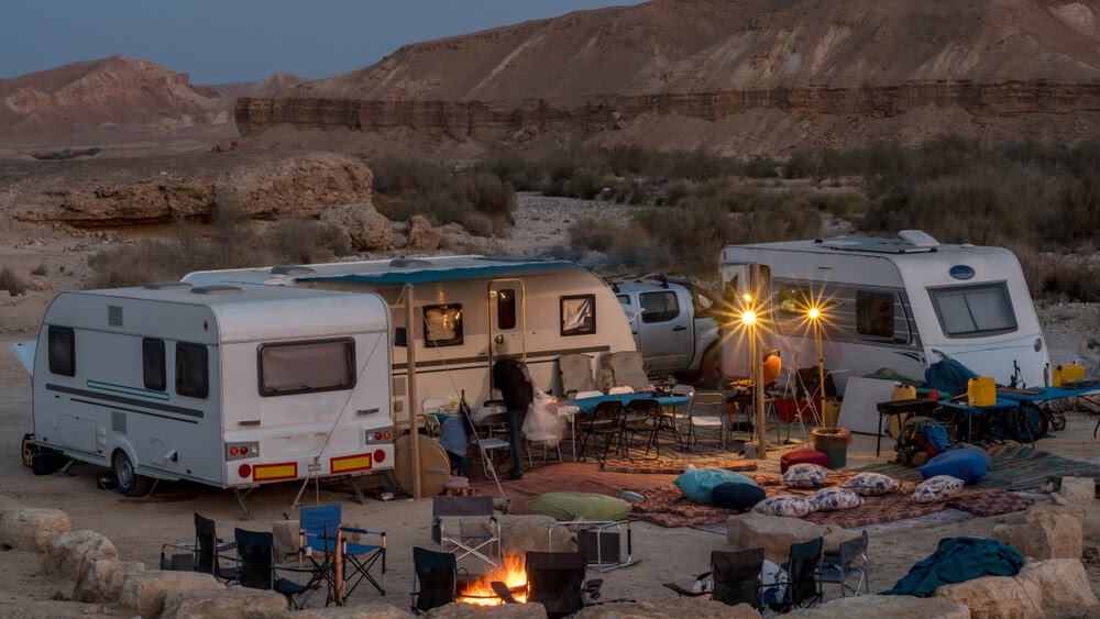 Group of RVs in the desert in the evening.