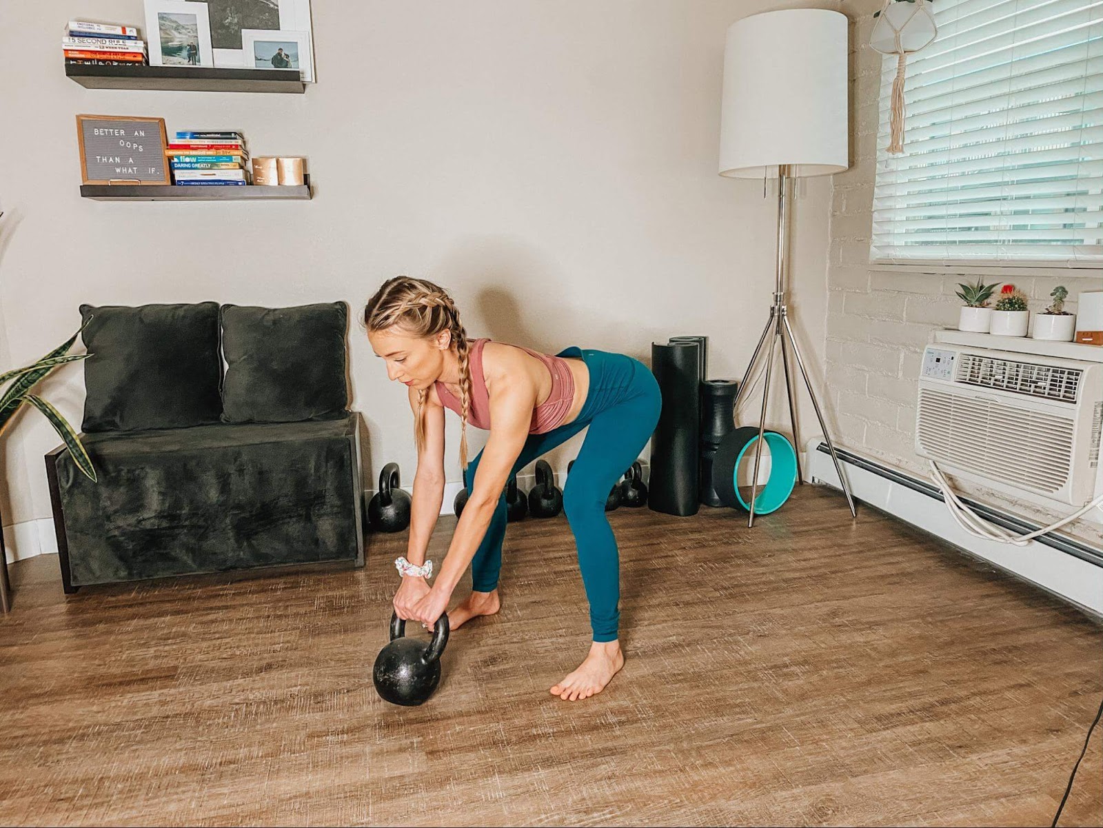 Woman performs a kettlebell swing