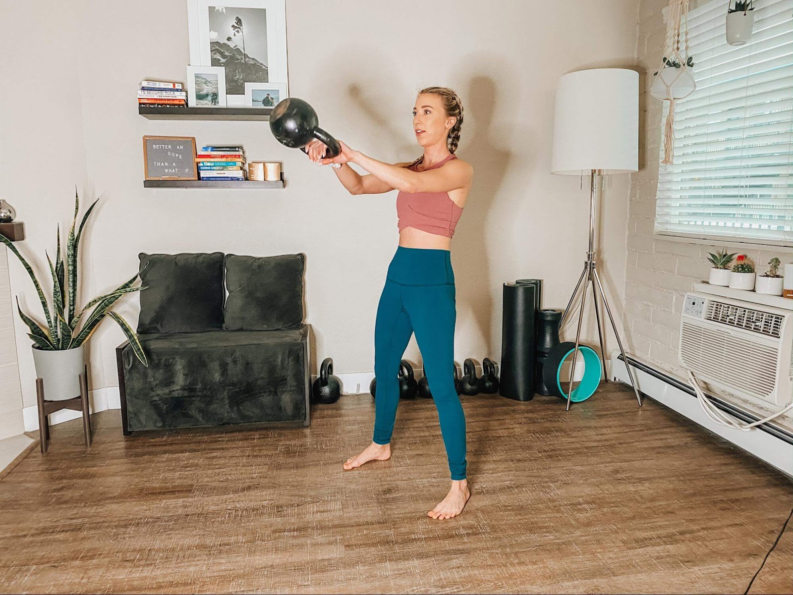 Woman performs a kettlebell swing