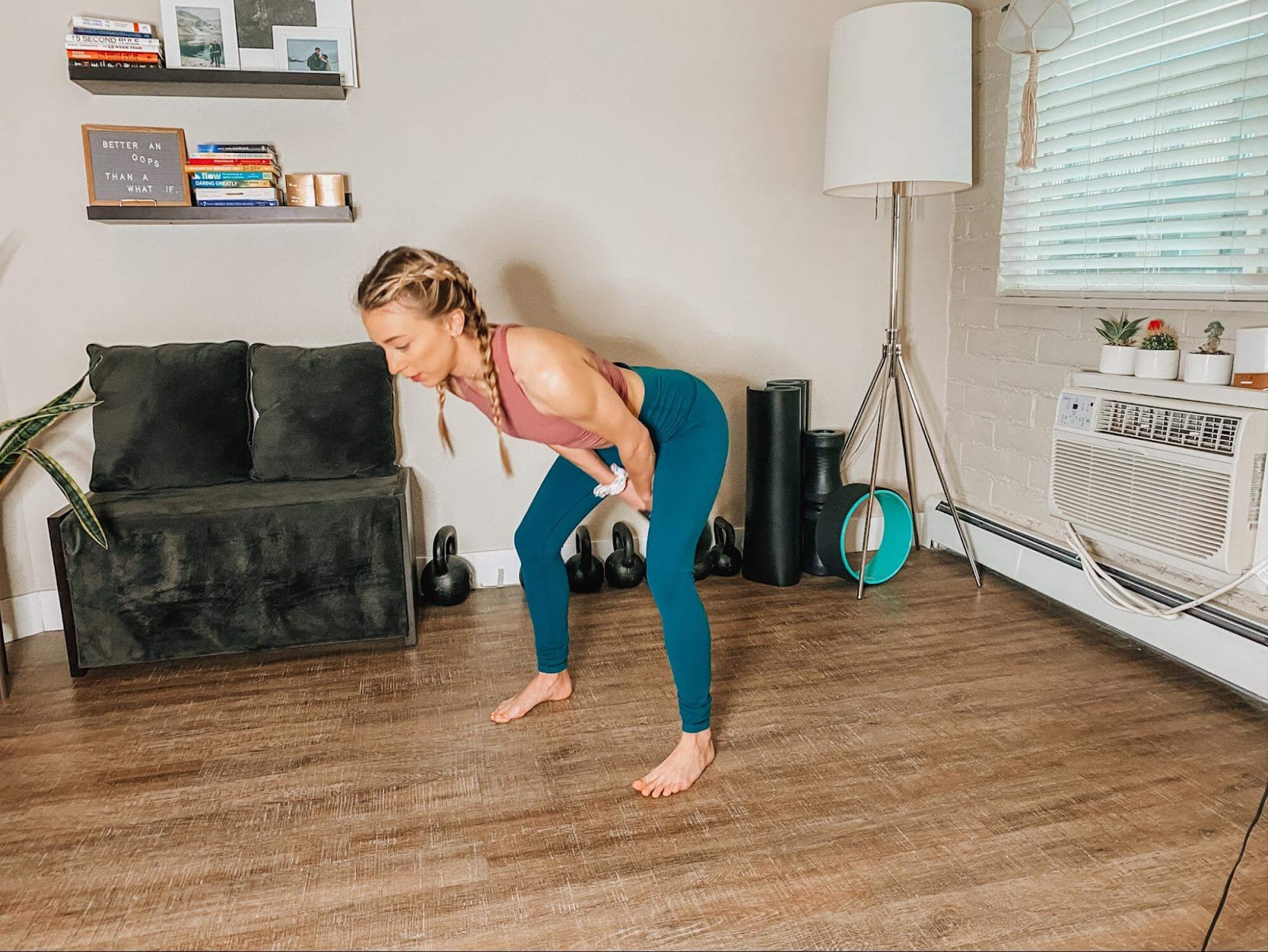 Woman performs a kettlebell swing