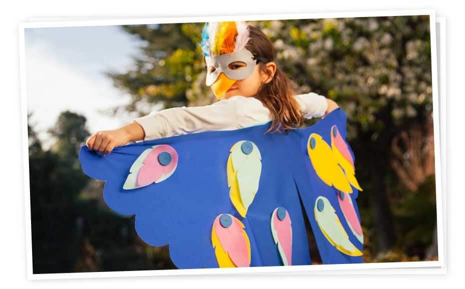 Child dressed as bird.