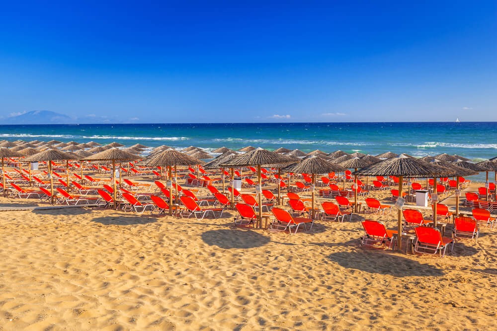 Banana Beach, Skiathos, Greece. Rows of chairs looking over the ocean.