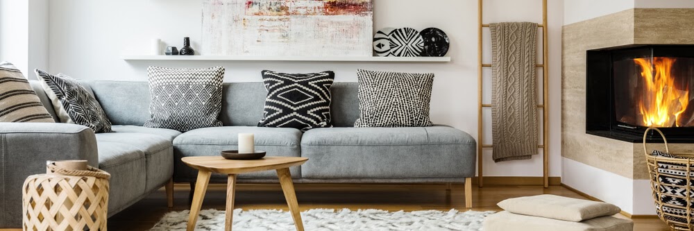 Living room with bold black and white patterns and warm wood elements