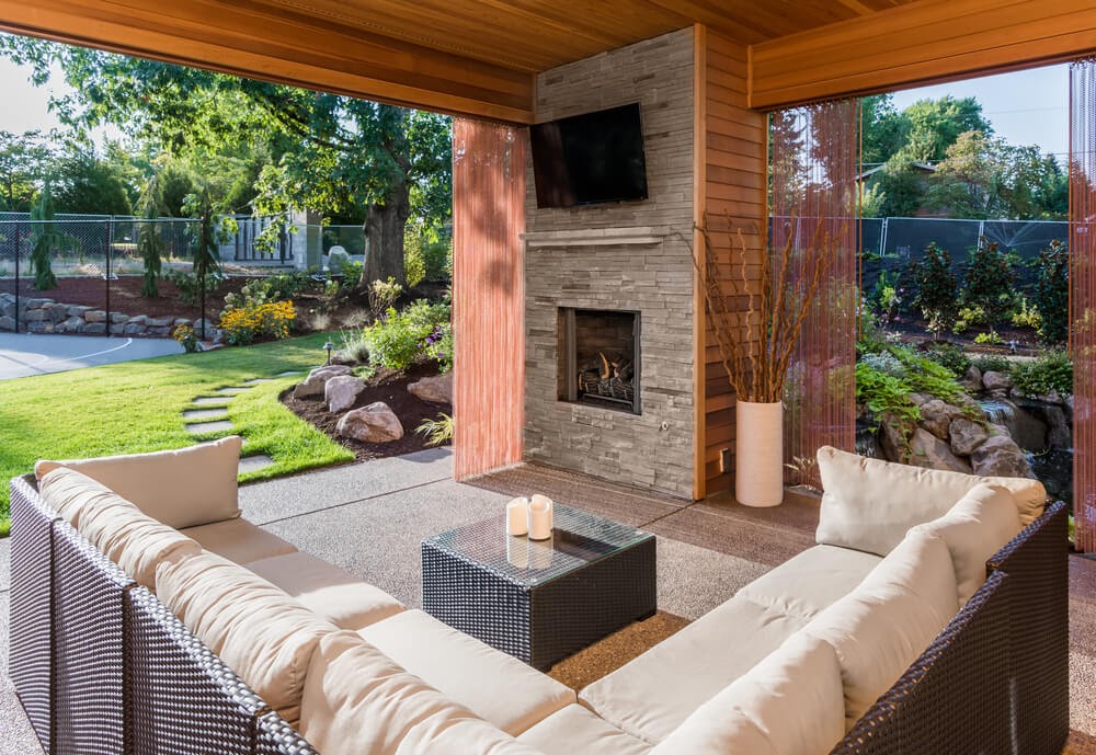 Patio with TV over fireplace
