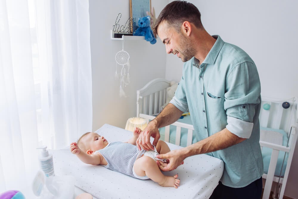 Dad changing a diaper