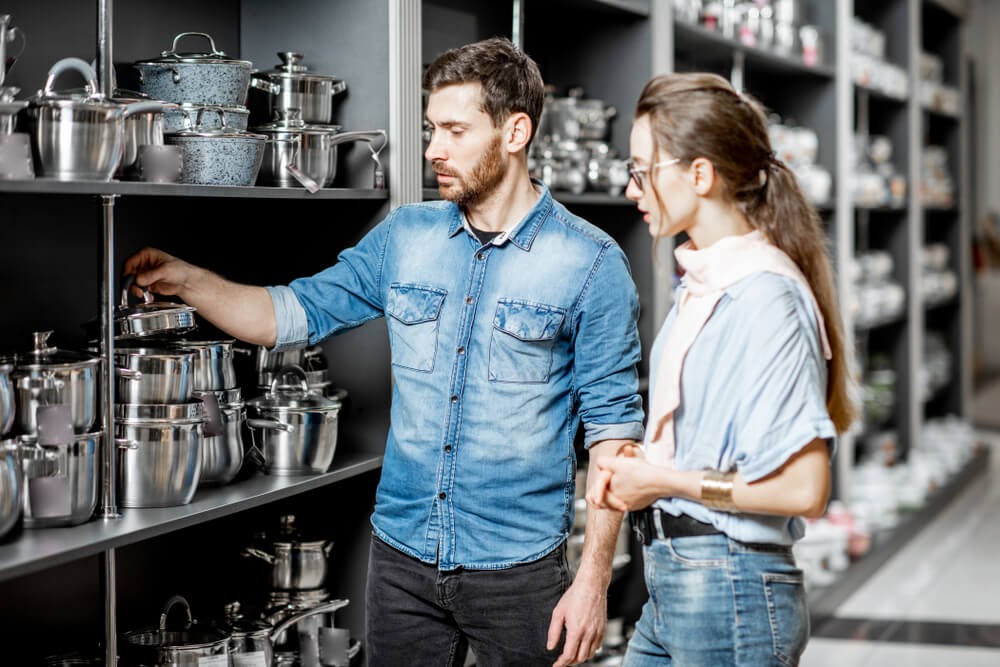 Two people shop for cookware