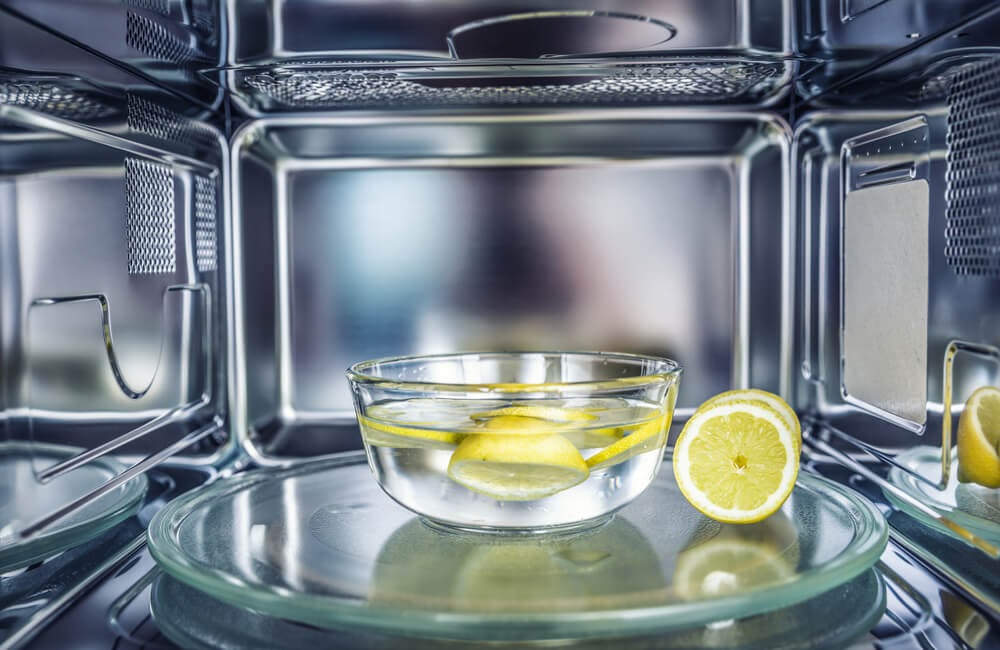Lemon water in a bowl inside a microwave