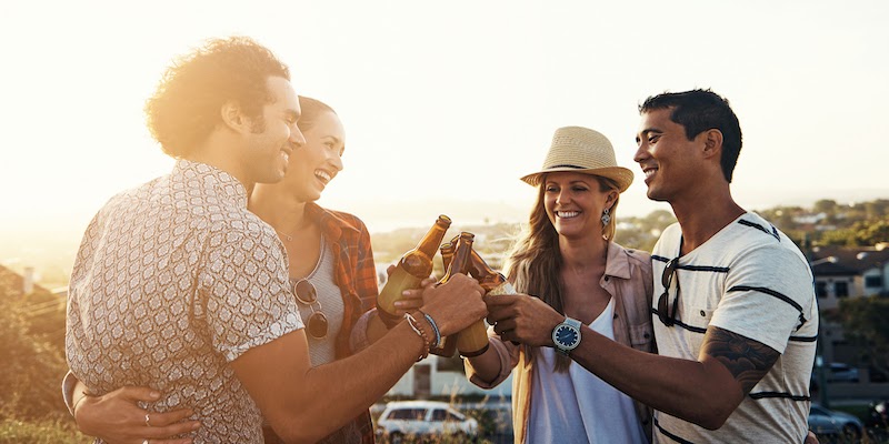 Friends toasting to nice weather and good times in a beautiful mountain scene