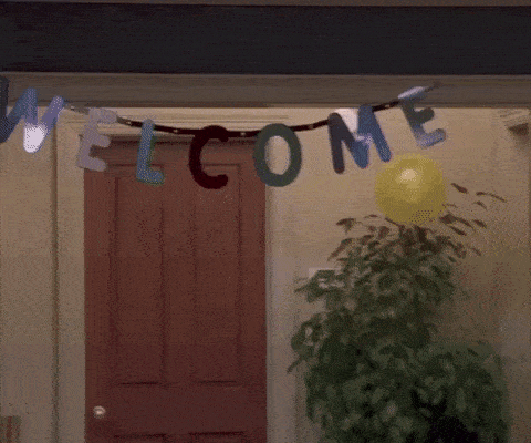 An animated gif from the TV show "Friends" depicting a man sitting alone in a room under a banner that says "Welcome"