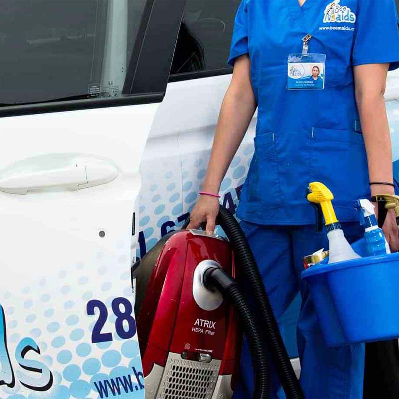 Bee Maids technician getting out of car