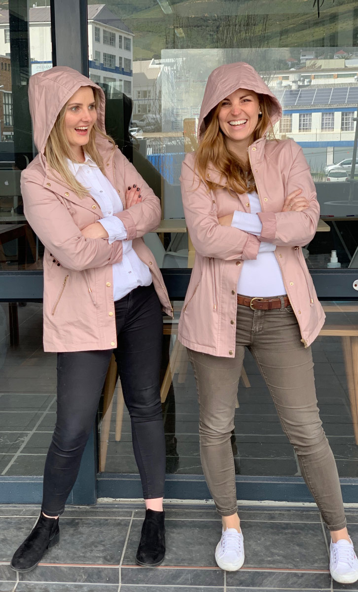Team members Tegan and Mri being twinsies with the same jacket.