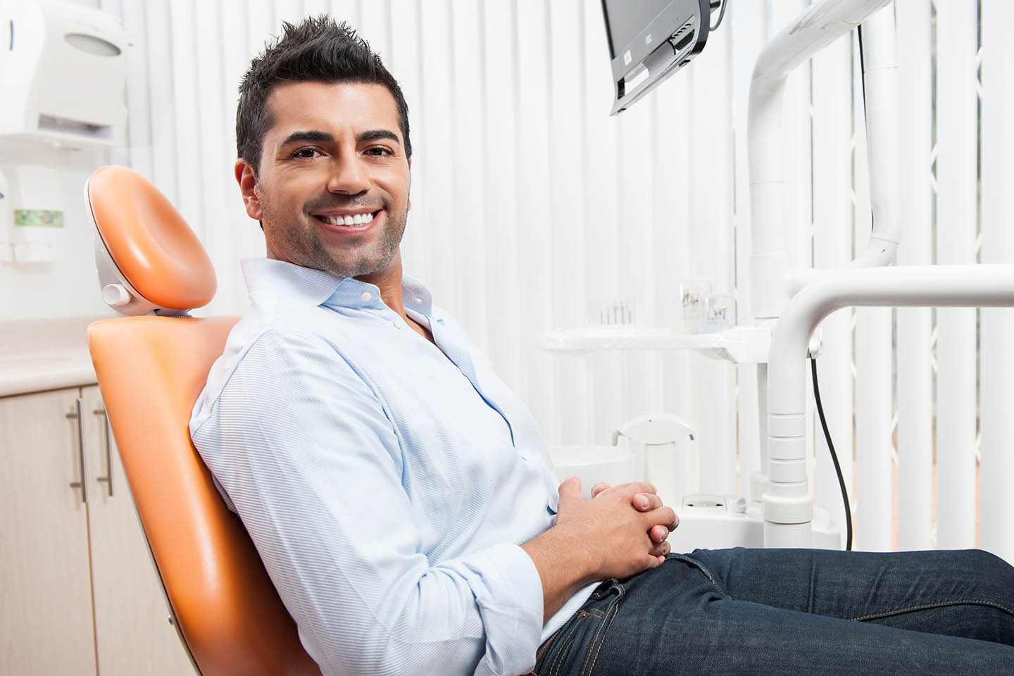 man sitting in dental chair