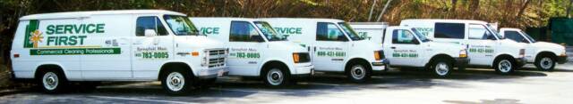 fleet of Service First Commercial Cleaning Services trucks