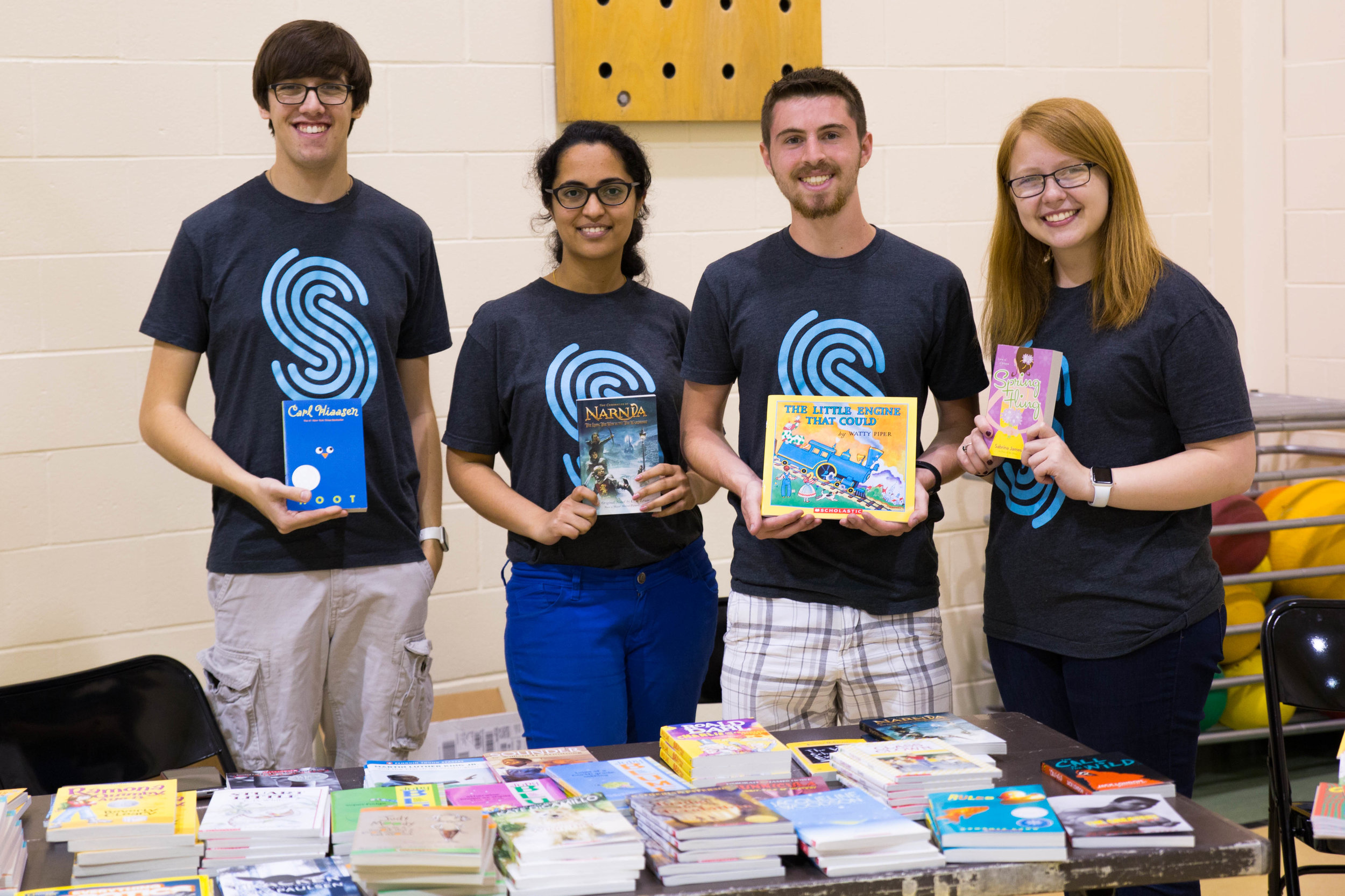 2017 interns host a book table during their intern-led community impact event, Read, Play, Go! This interactive event brought elementary students together with Spreetailers for a day of learning, creativity, and play. Spreetail donated books for the students to take home, plus new sports equipment shared with five area schools.