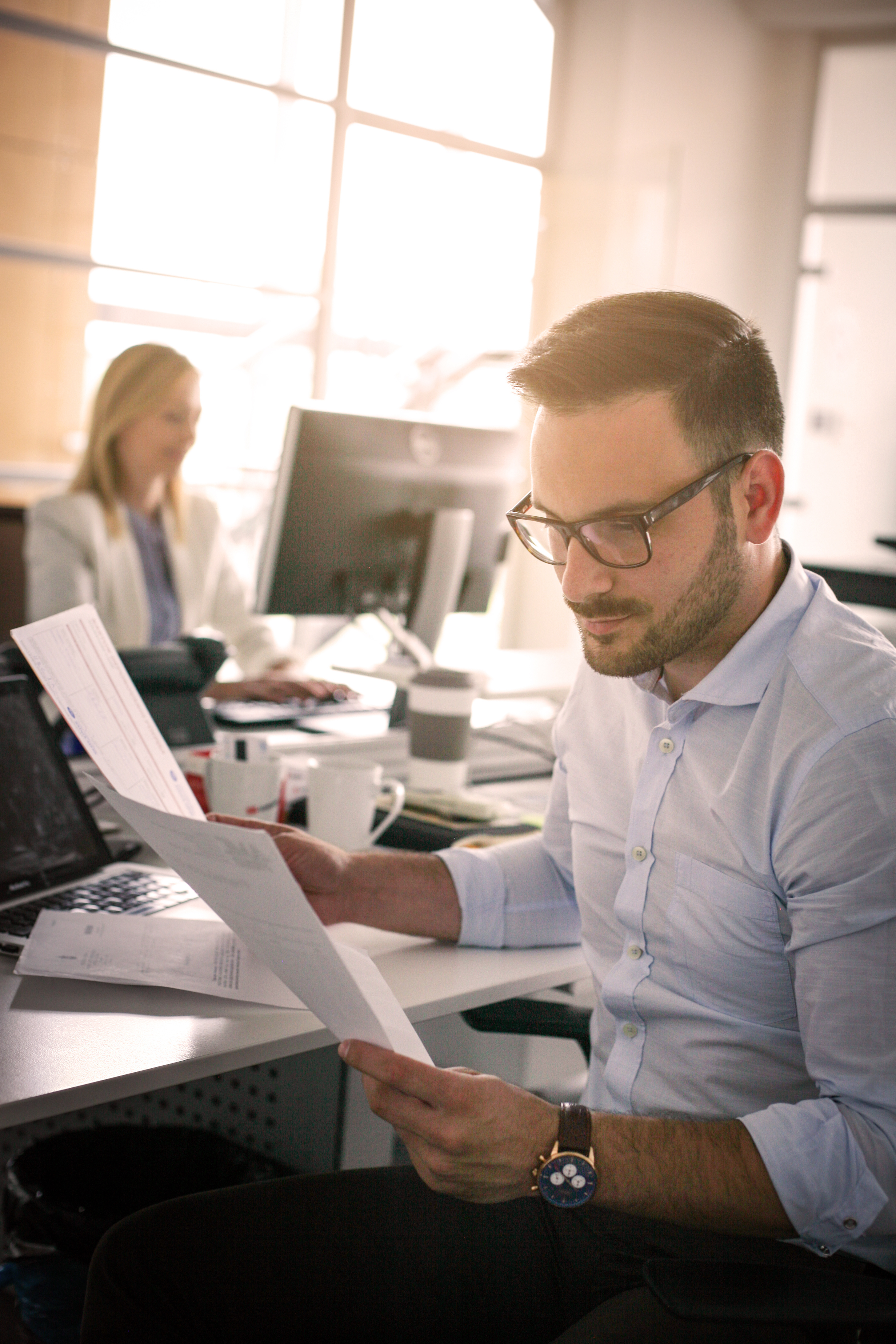 man looking at reports