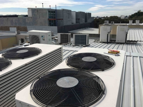 Campbelltown Air Conditioning Employee Cleaning A Filter