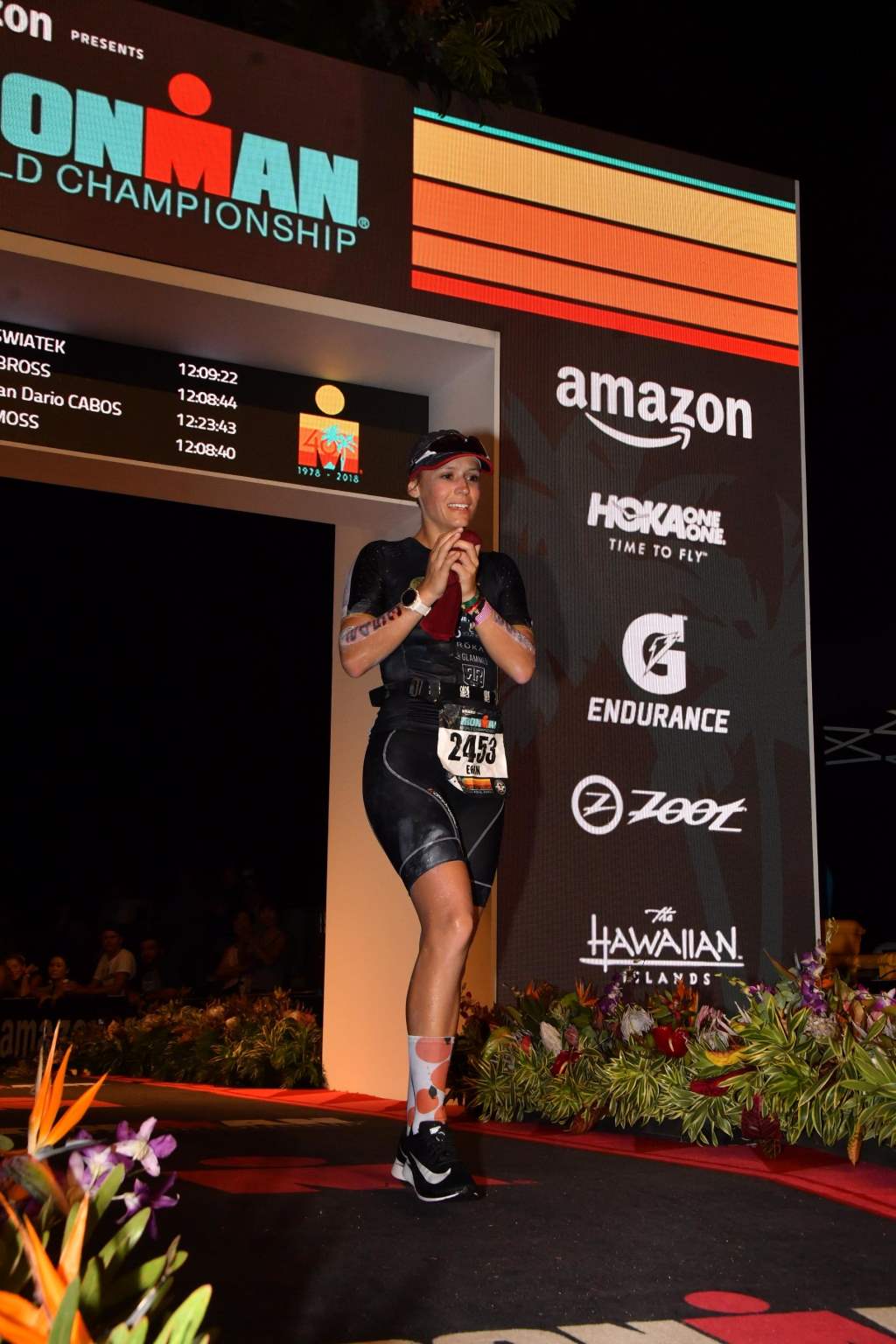 Erin Swiatek crossing the finish line at the IRONMAN World Championships.