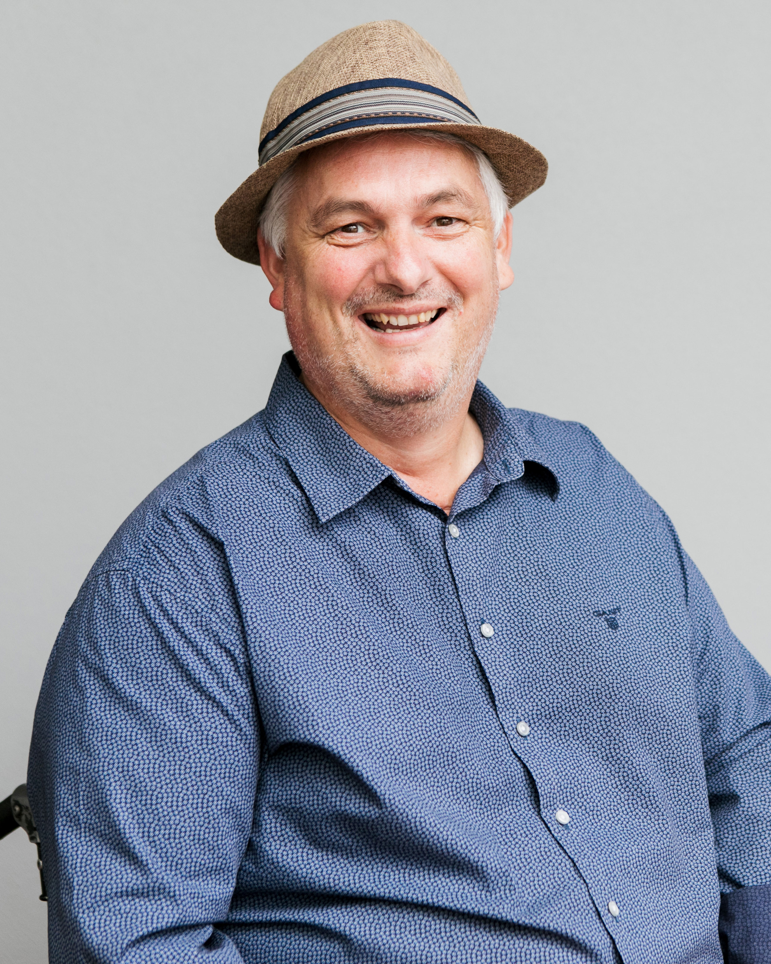Smiling man wearing a hat