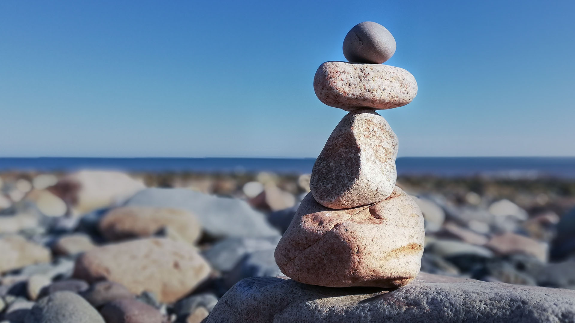 stack of zen rocks in an outdoor setting to indicate a focus on mental health