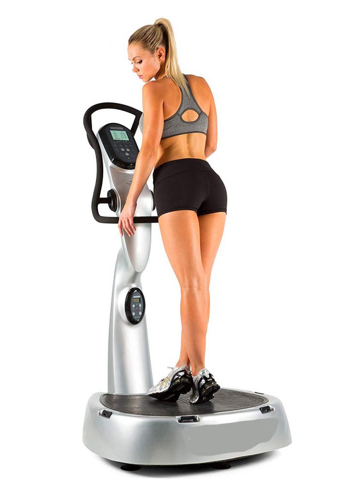 Women exercising on whole body vibration machine