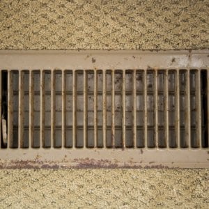 Air duct vent with carpet around it