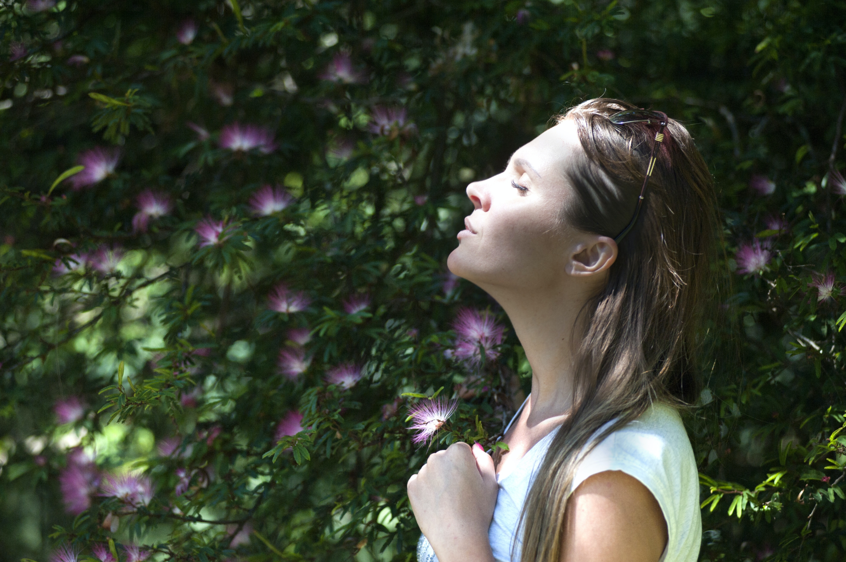 Woman with asthma and epilepsy taking a deep breath in the outdoors