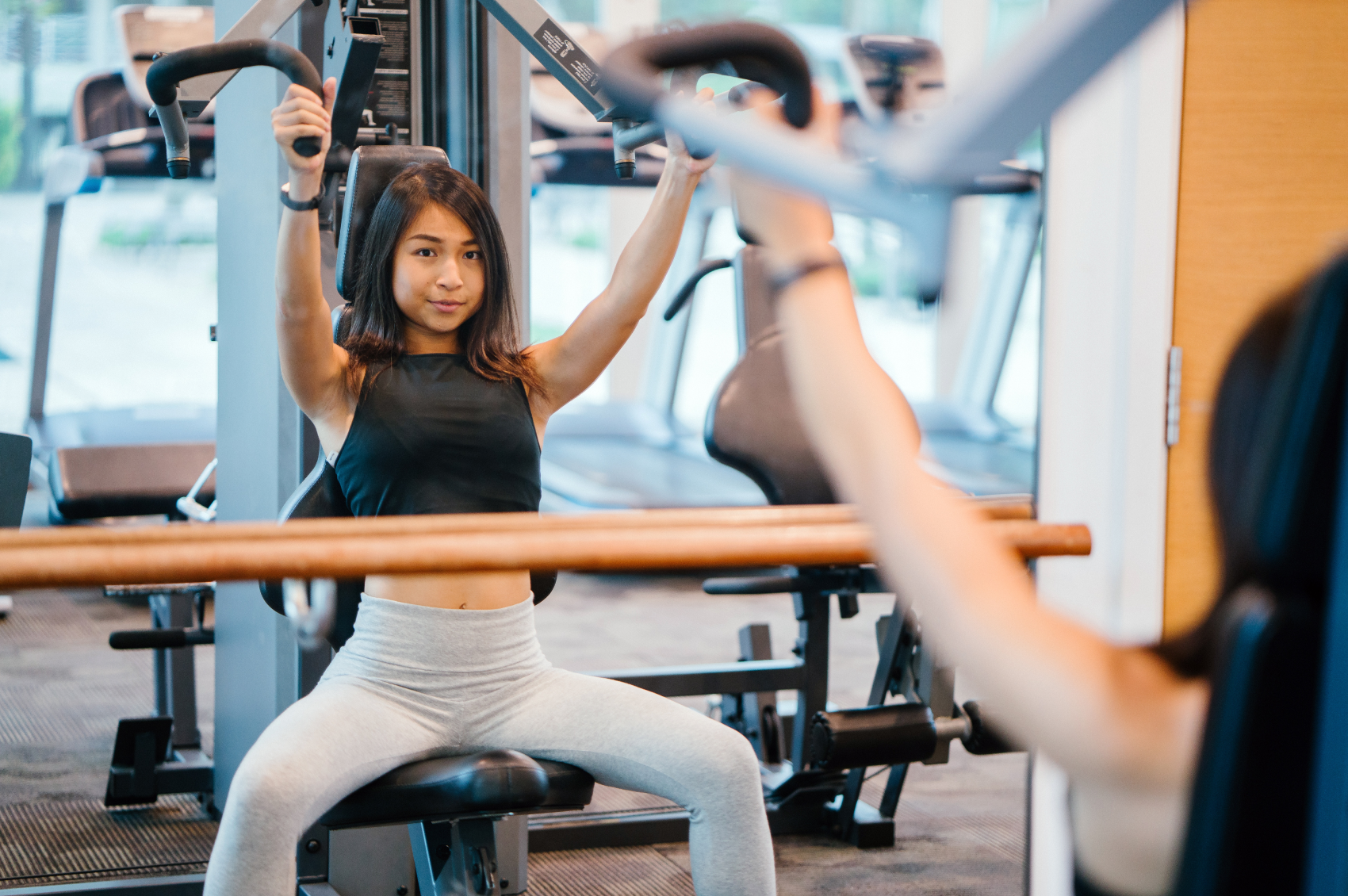 Woman using gym machine