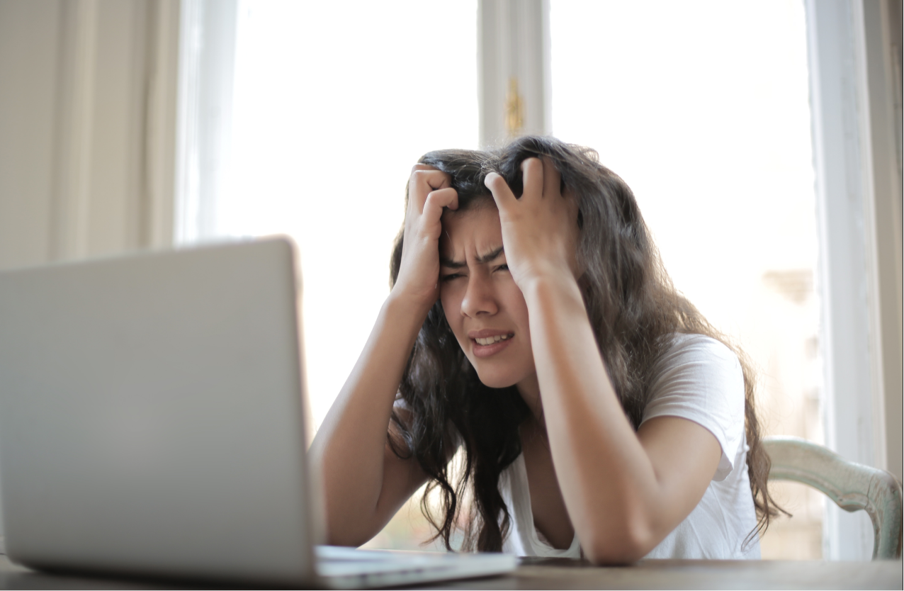 Stressed woman with PNES looking at her computer