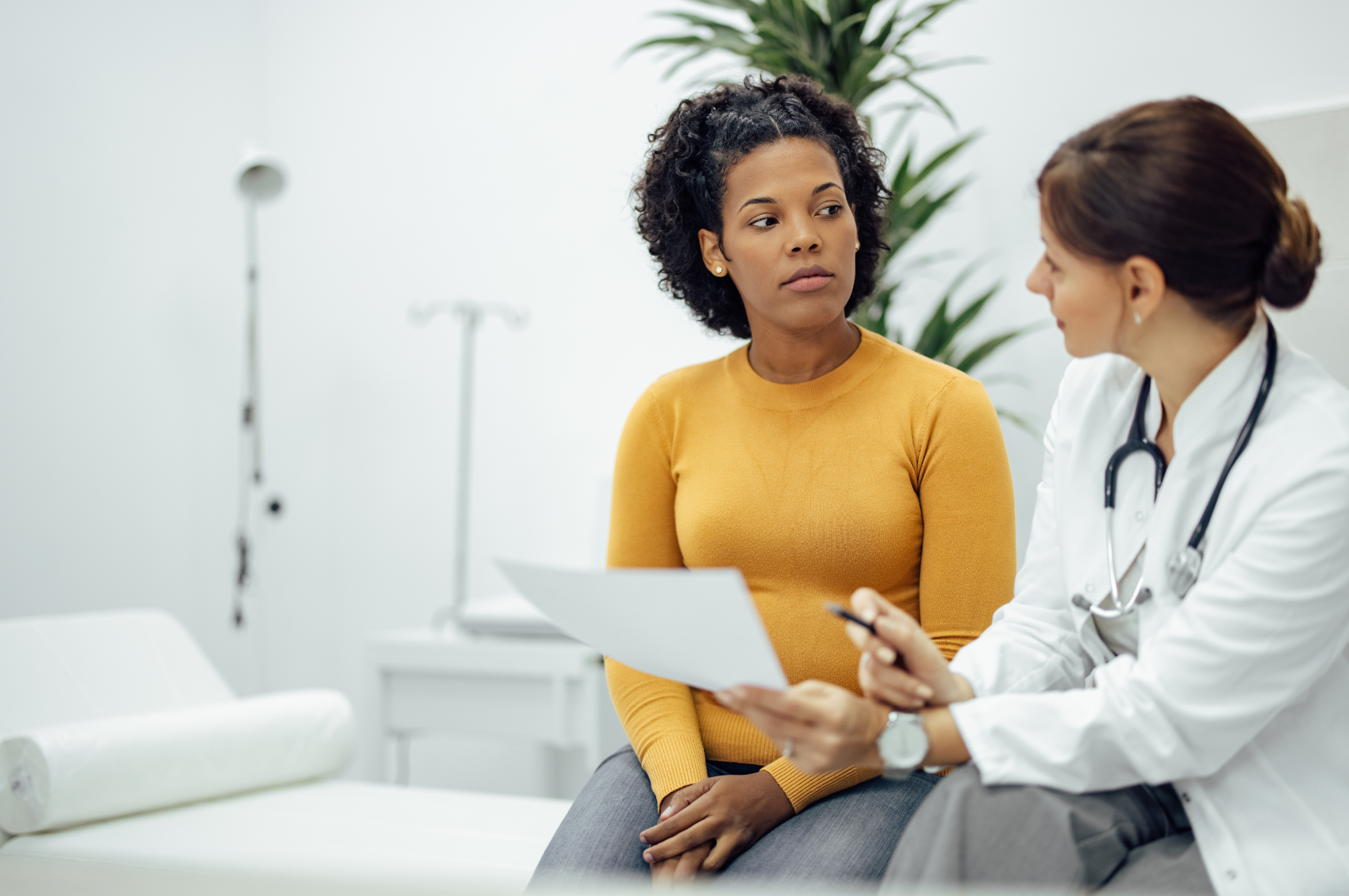 Woman speaking to a doctor about her brain injury