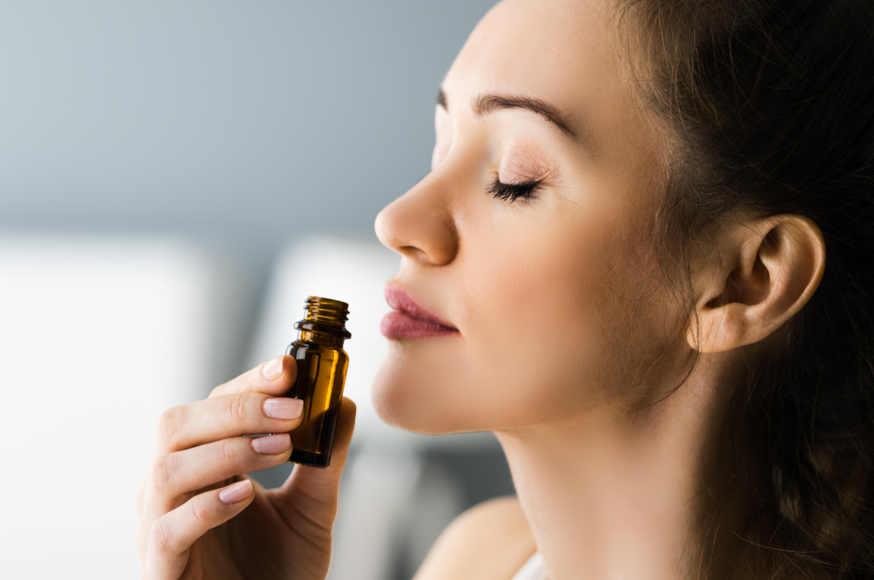 Woman with epilepsy smelling essential oils