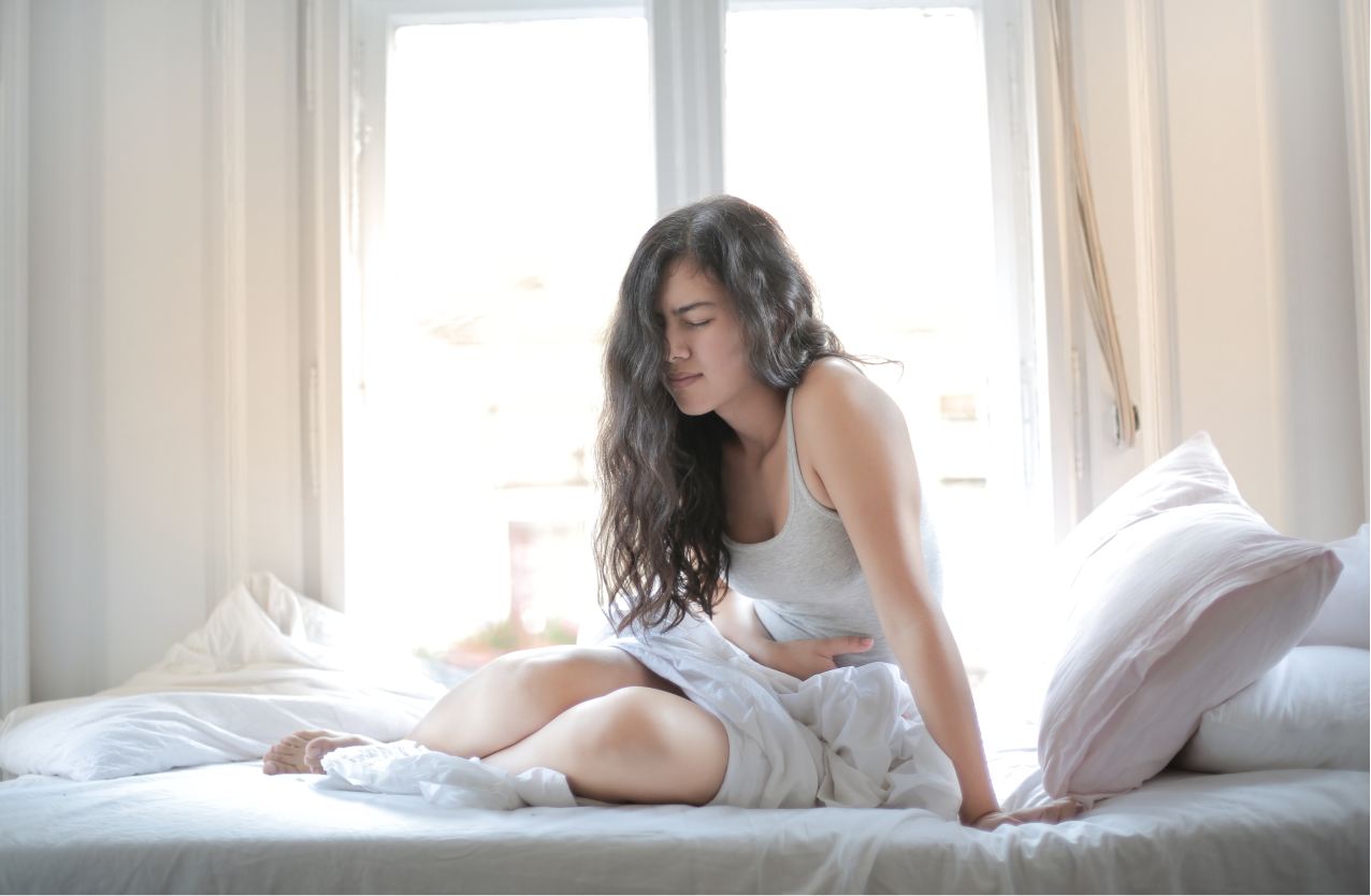 A woman suffering with stomach pain – a symptom of abdominal epilepsy