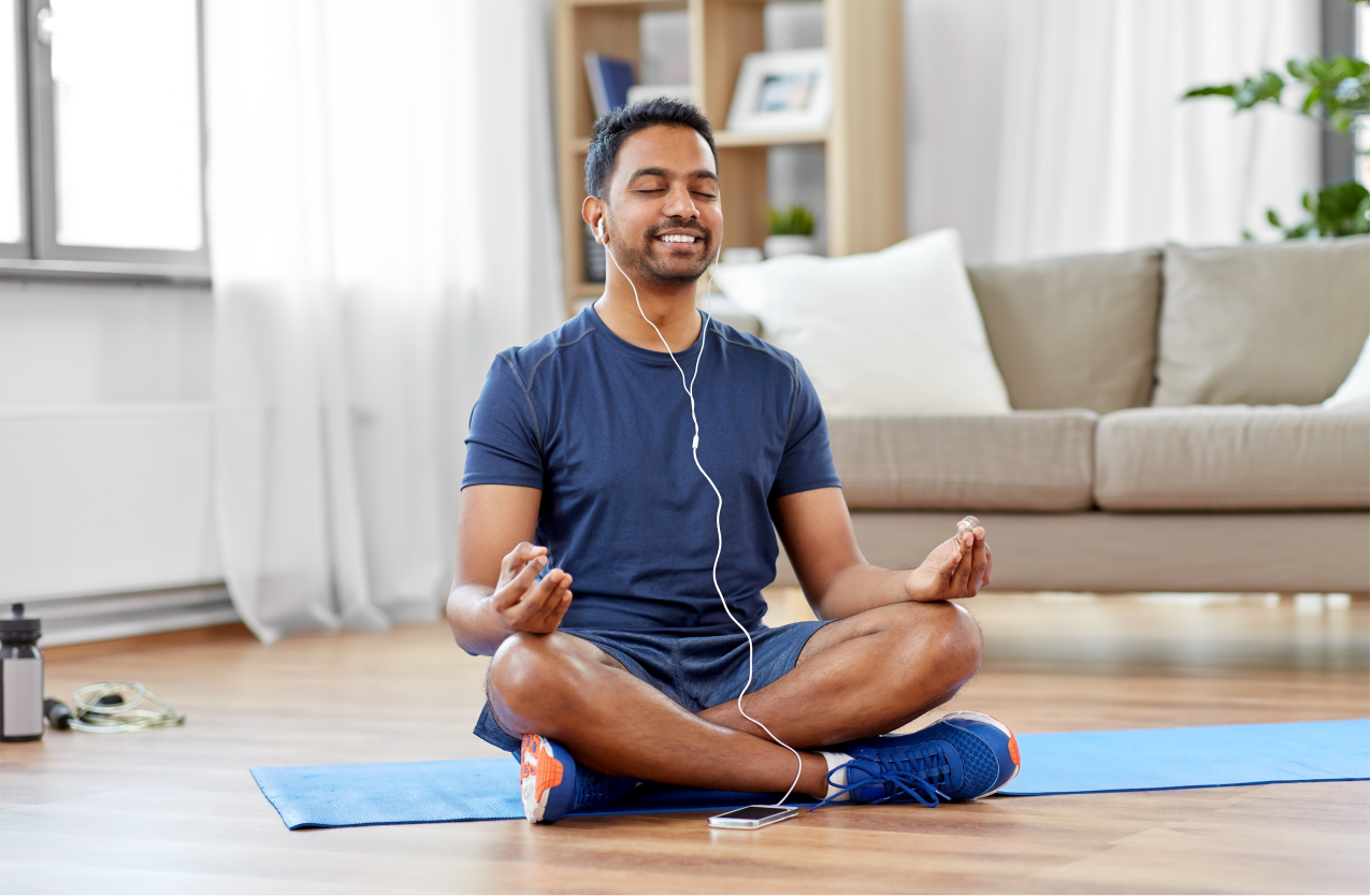 Man meditating at home