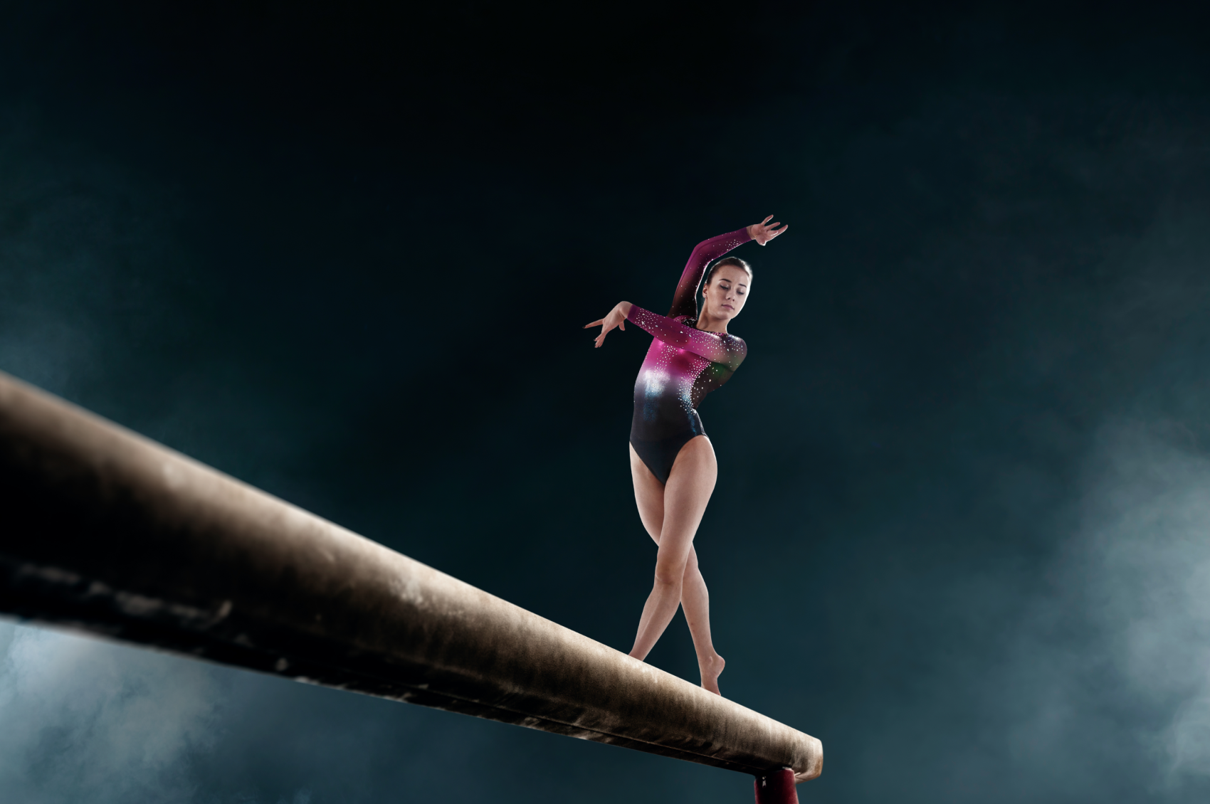 Gymnast trains on a bar