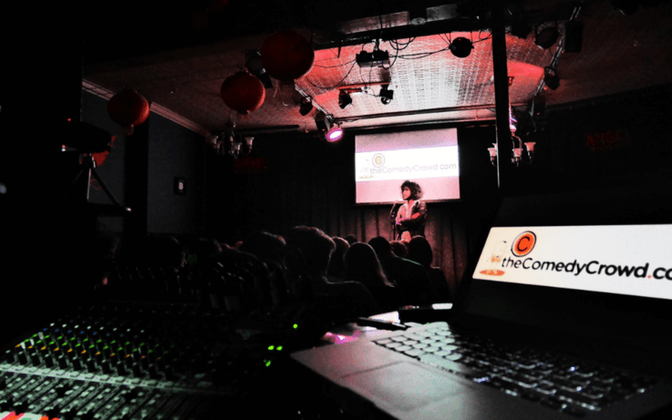 Person on stage, audio equipment