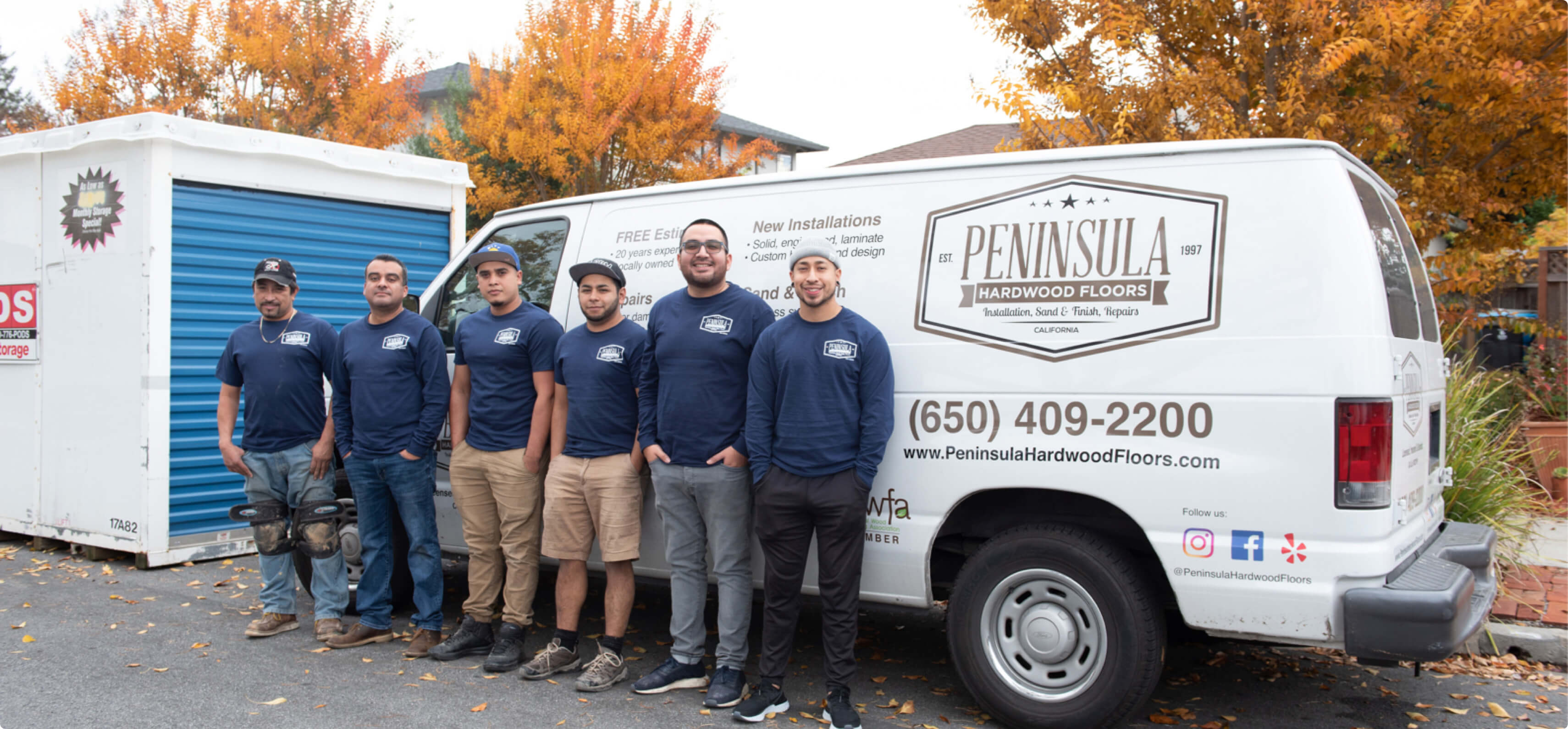 Hourly customer Peninsula Hardwood Floors workers outside on the field