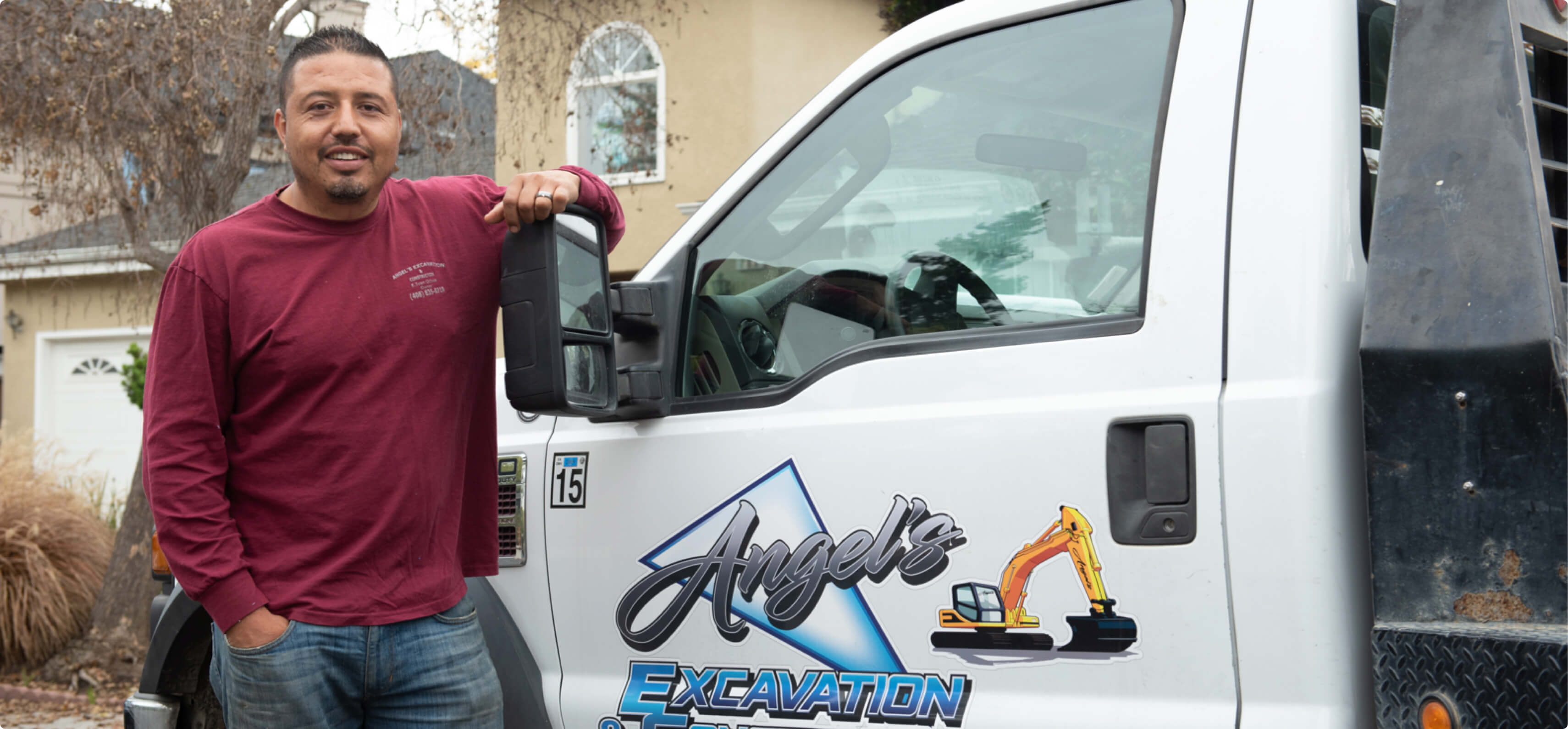 Hourly customer Edgar Ochoa beside their truck.