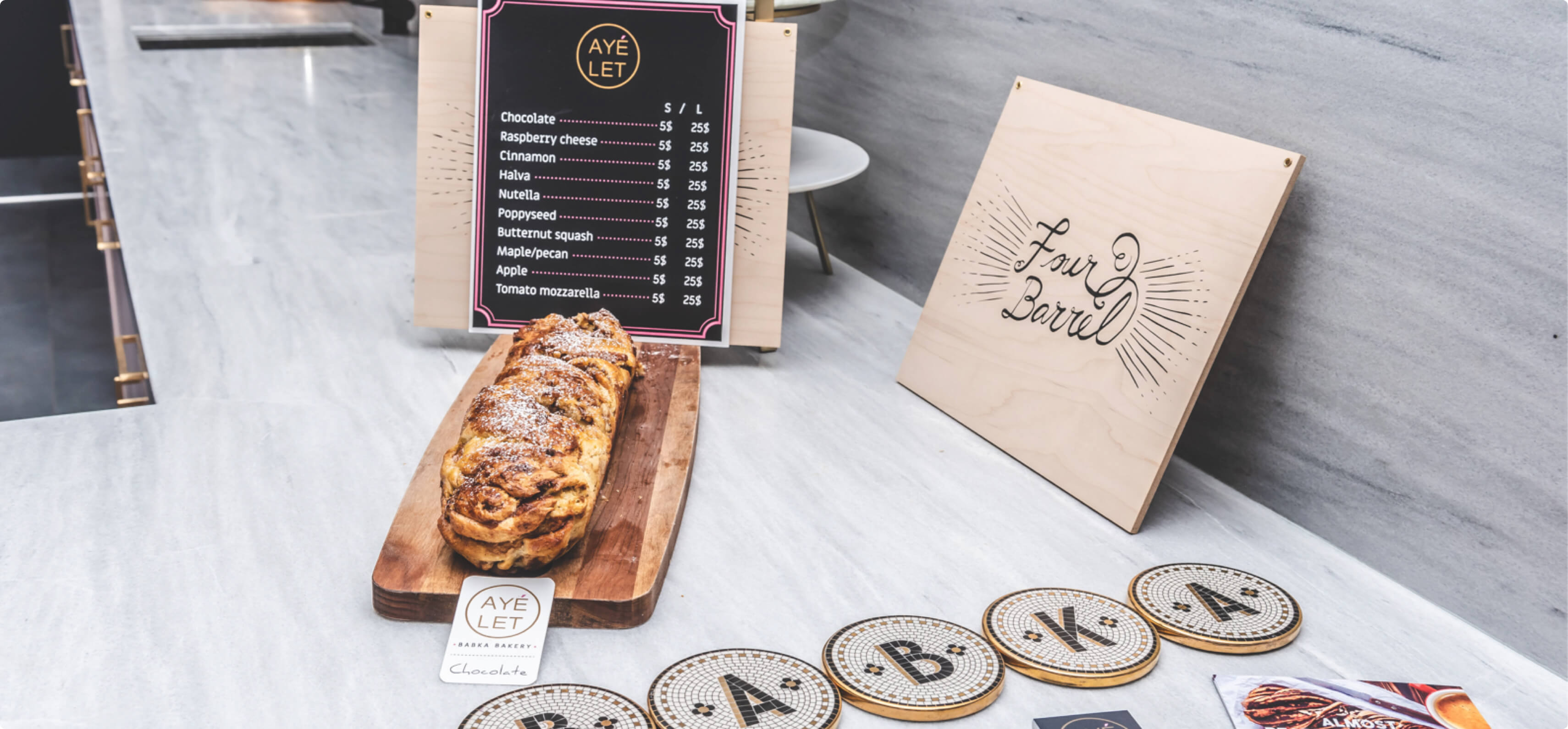 Hourly customer Babka by Ayelet delicious pastry on the table with the menu.