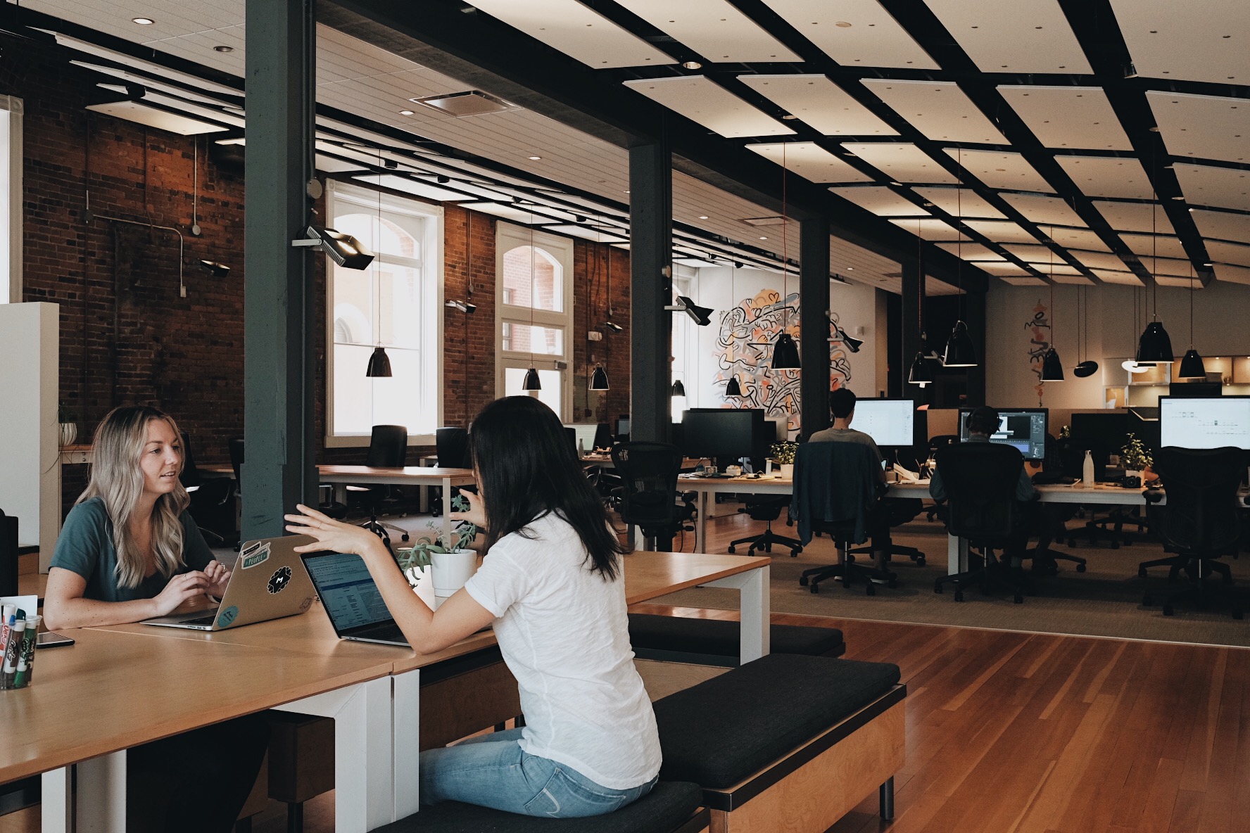 Two of MetaLab's product designers collaborating at the Victoria HQ