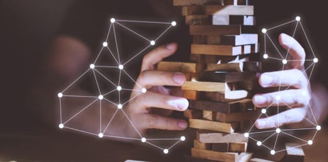 hands manipulating puzzle with technology design