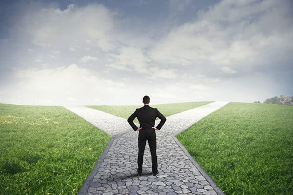 Man standing on paved path