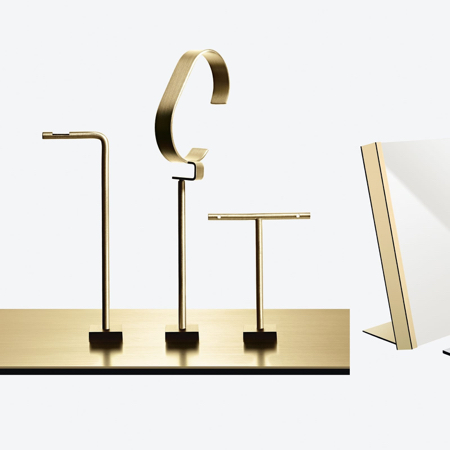 Jewellery displays in gold with magnetic bases for visual merchandisers