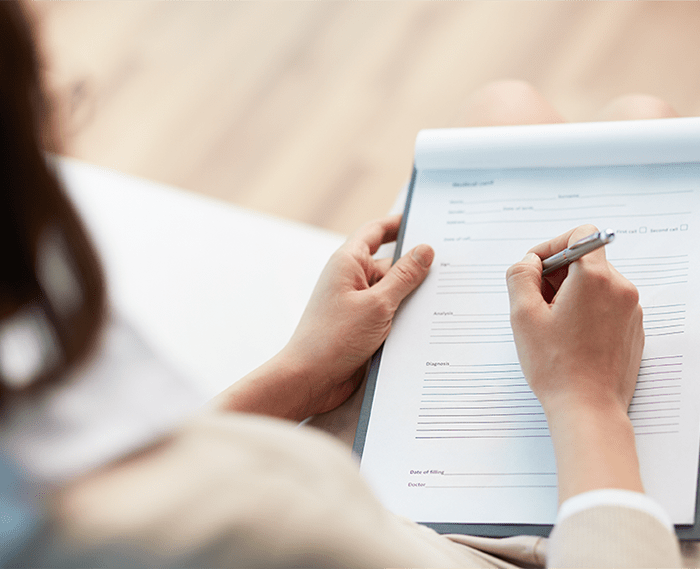 Woman filling out financial paperwork