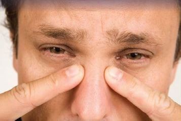 Man suffering from sinus blockage