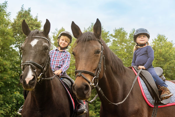 Happy kids on horses