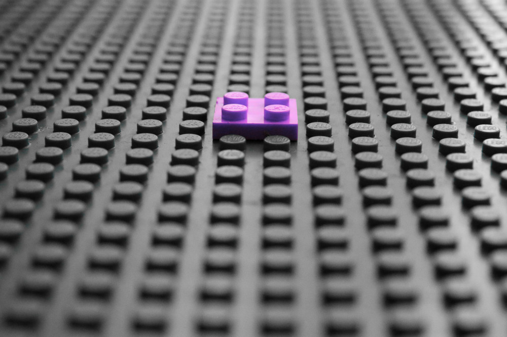 A lego piece built on a flat surface