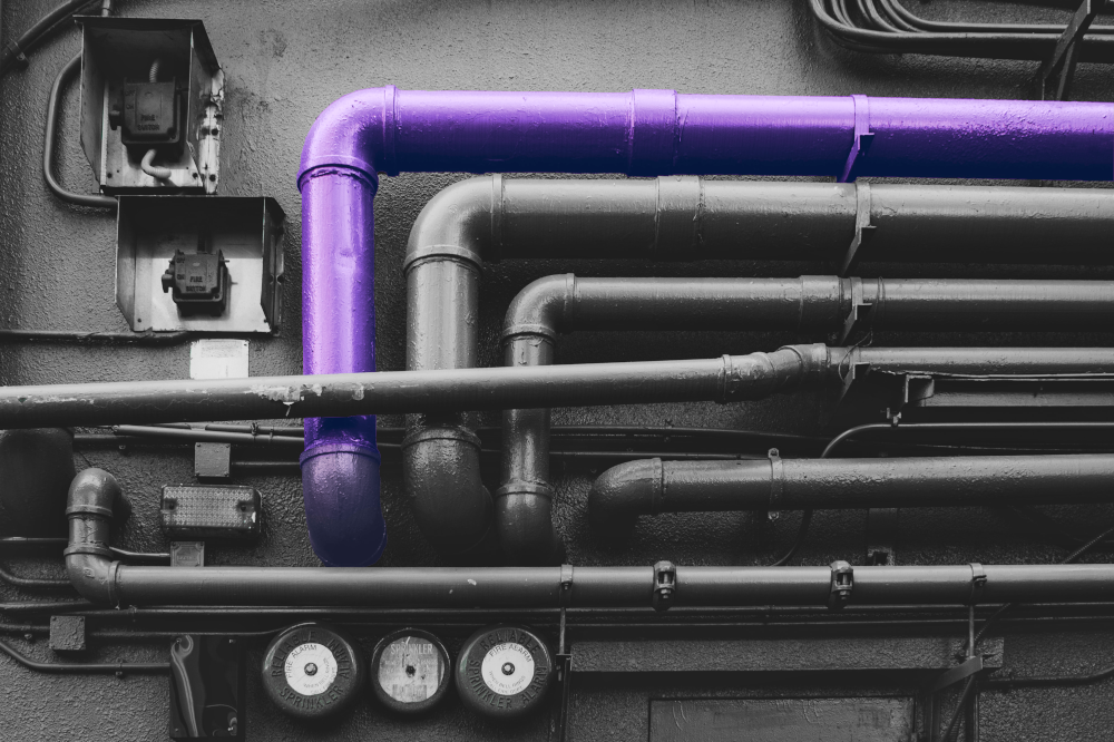 Some pipes, one is purple. Meant to illustrate connected data sources