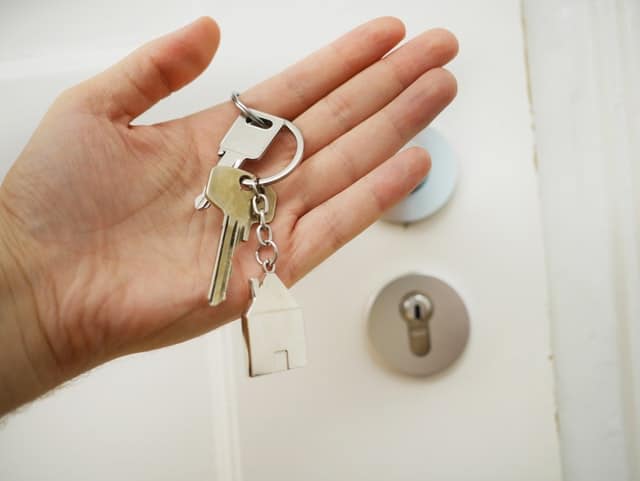 person holding house keys