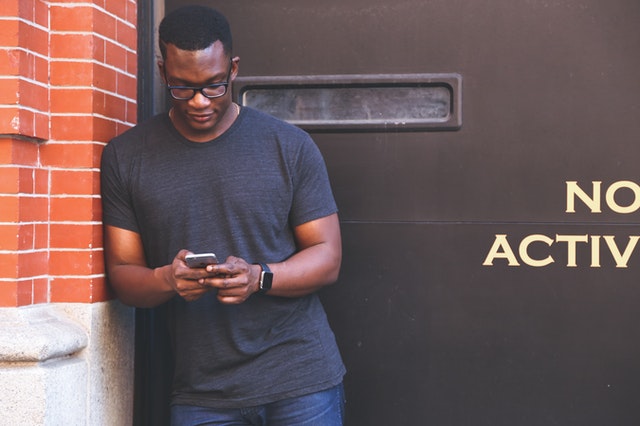 man texting on phone