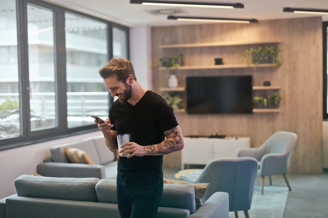 man texting on phone